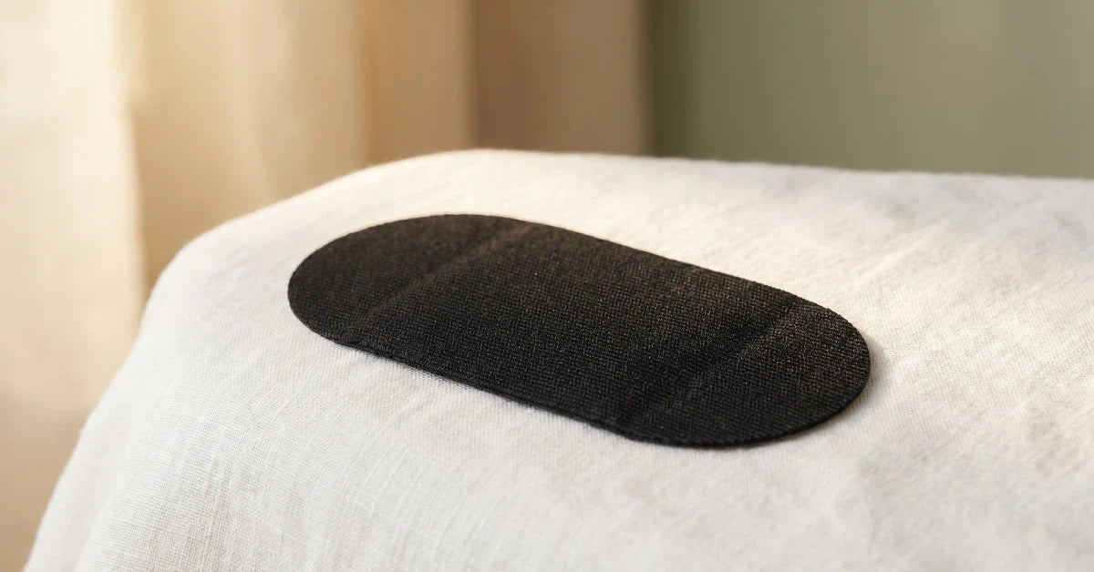 Single piece of mouth tape on white linen background